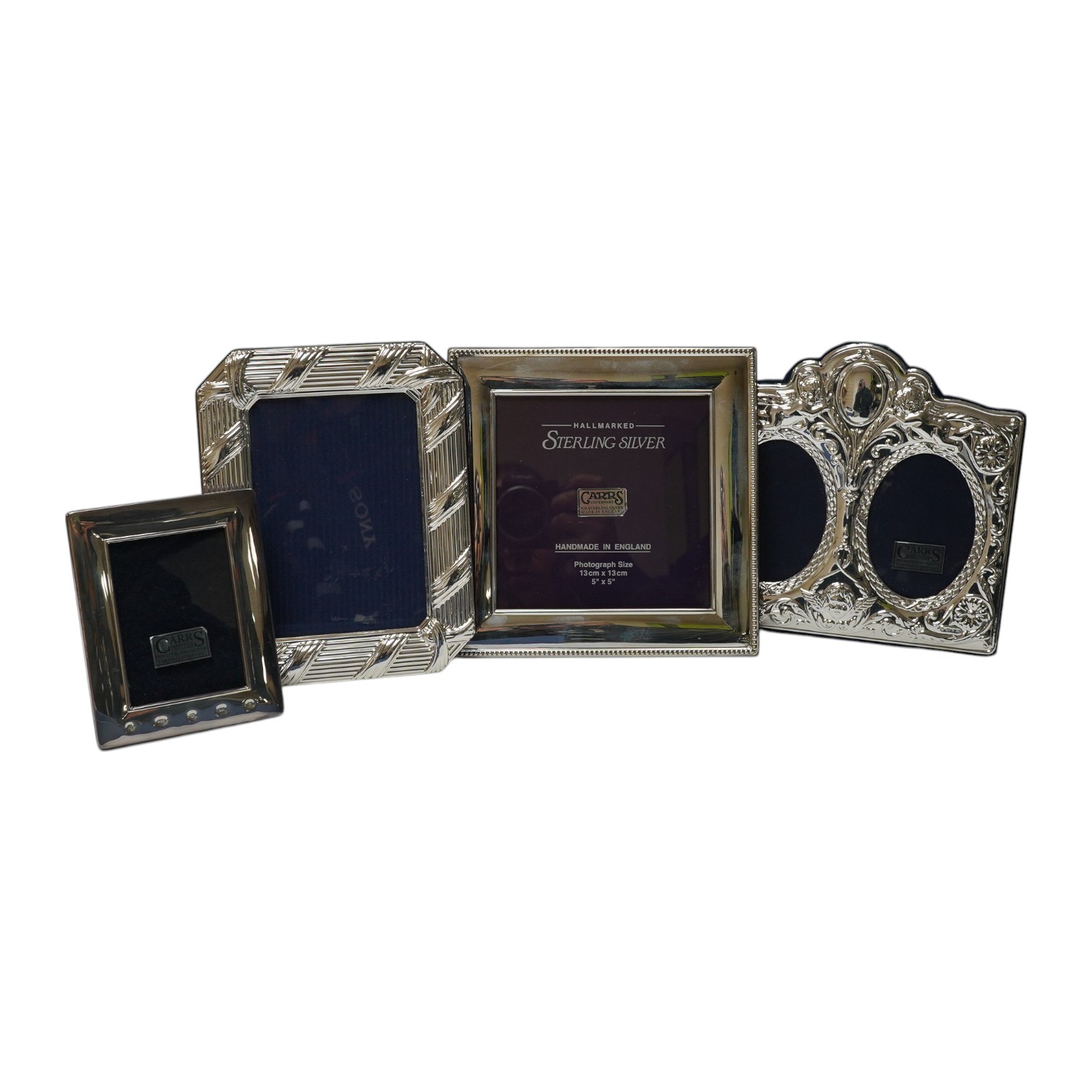 A modern boxed Carr's of Sheffield, silver mounted double photograph frame, width 18.3cm, together with two other silver mounted photograph frames and an Italian silver plated frame. Condition - good